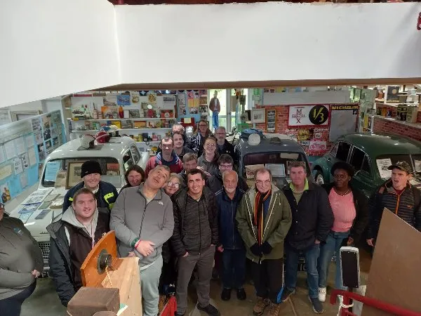 A large group of Cynnig members and staff together in a room